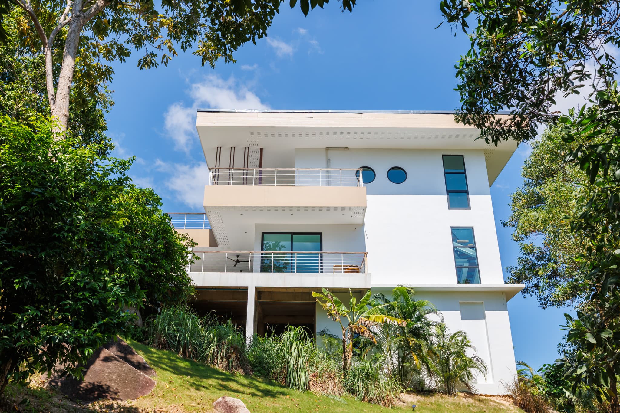 White villa facade seen from the tropical garden, Koh Phangan