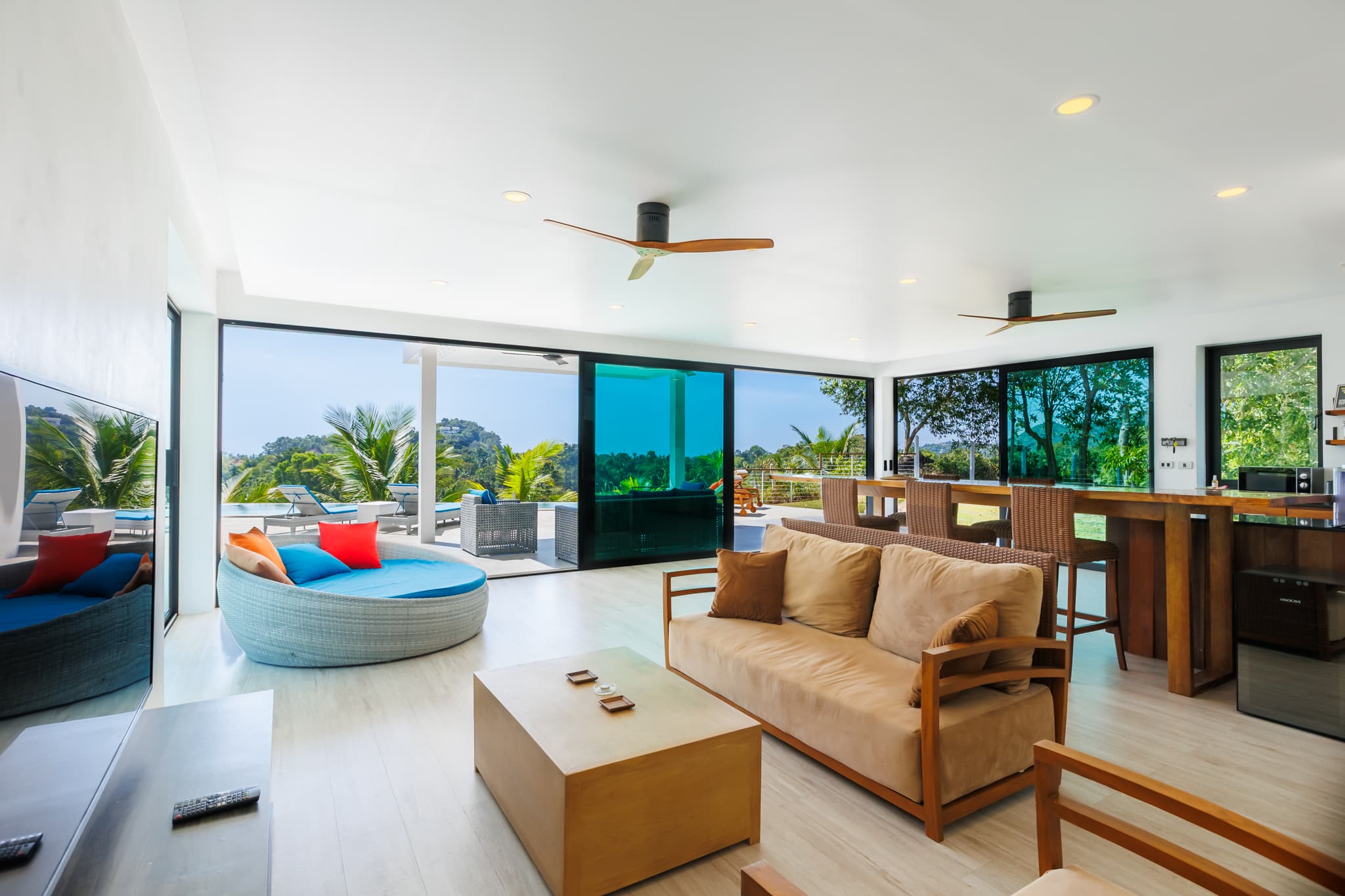 Living room with sofa, round daybed and pool view at Villa Sekoya, Hin Kong Bay, Koh Phangan